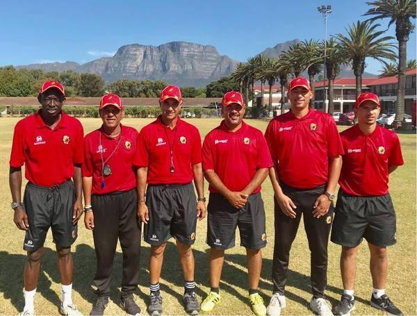 Santos FC coaching staff pictured pitch-side