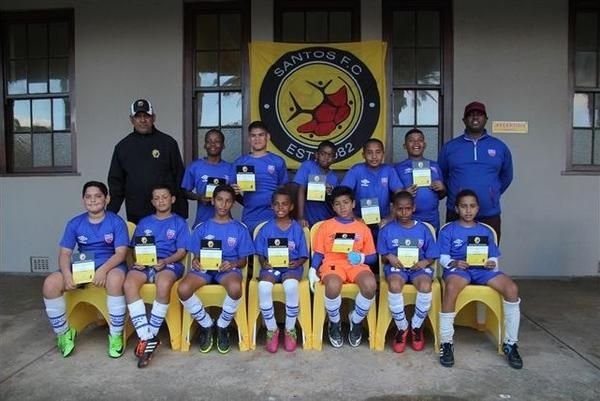Santos FC Academy squad in blue kit at the clubhouse