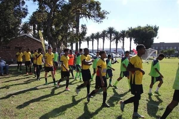 Santos FC Academy players walking out onto the pitch