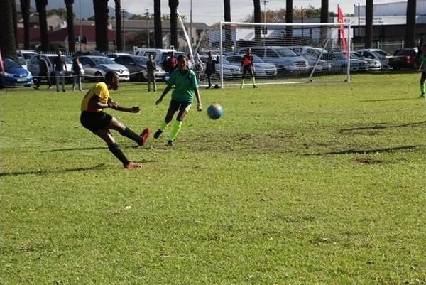 A Santos FC player strikes the ball during a match